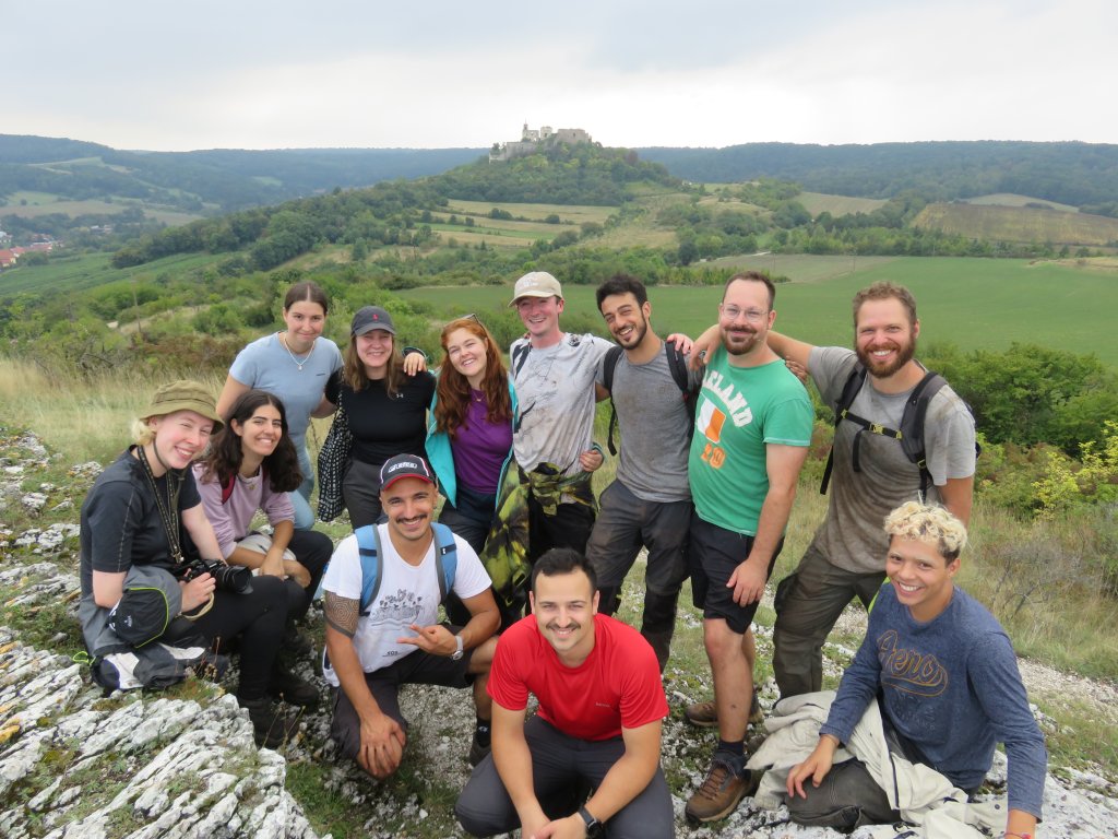 A photograph of a group of volunteers posing for a photo outdoors in Falkenstein, Lower Austria.